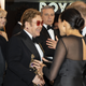 Image for article titled Elton John Now Implicated in Megxit
